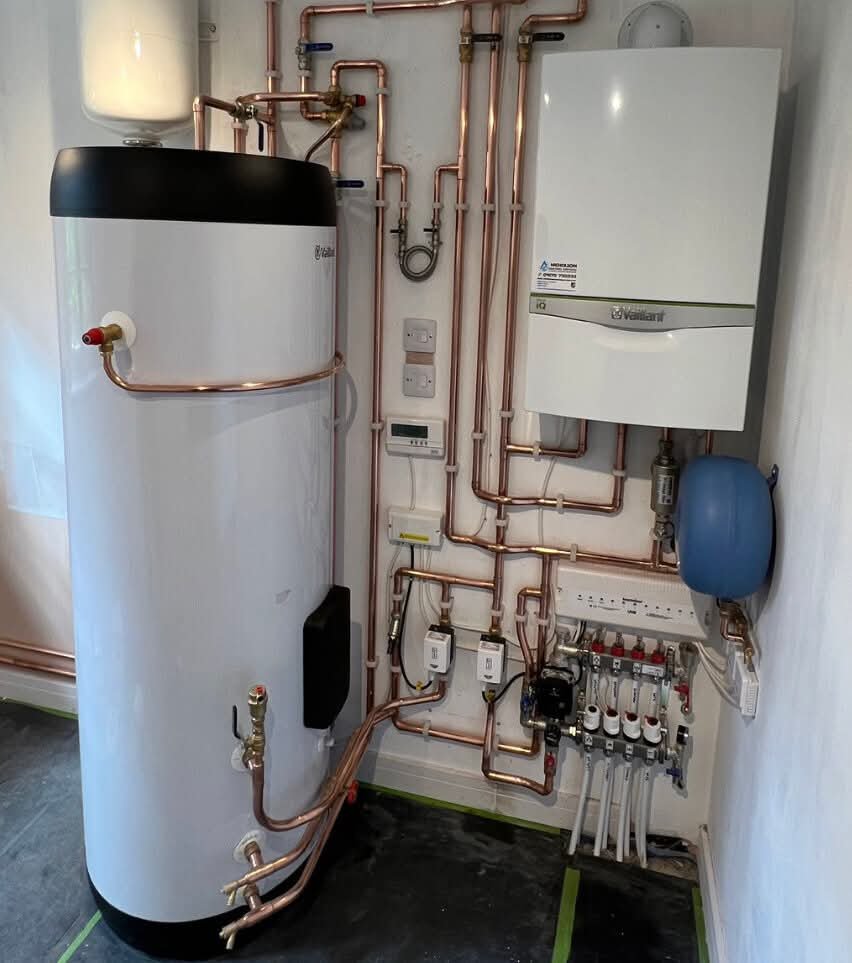 Vaillant boiler, cylinder and copper pipework install in a domestic plant cupboard